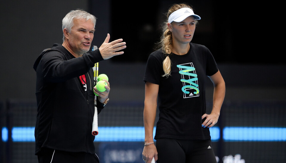 Coach and father Piotr Wozniacki gives advice to Caroline Wozniacki of Denmark