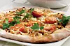 Pizza med tomater og bløde løg