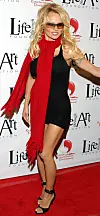 BEVERLY HILLS, CA - DECEMBER 13:  Actress Pam Anderson attends 'The Red Party' on December 13, 2003 in Beverly Hills, California.  (Photo by Giulio Marcocchi/Getty Images)