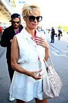 AUSTIN, TX - NOVEMBER 01:  Actress Pamela Anderson leaves the Infiniti Red Bull Racing garage after qualifying for the United States Formula One Grand Prix at Circuit of The Americas on November 1, 2014 in Austin, United States.  (Photo by Mark Thompson/Getty Images)