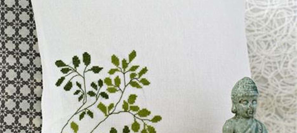 Sy en flot pude med broderet gren