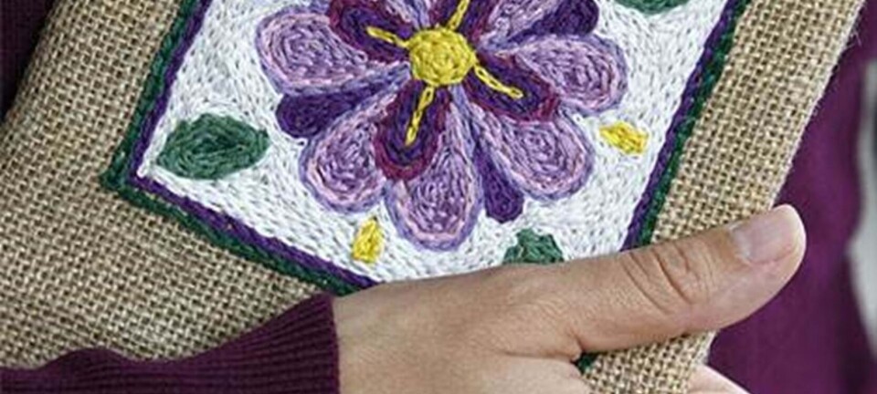 Mal med kædesting: Bogomslag med broderi