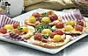 Pizza med skinke og cherrytomater