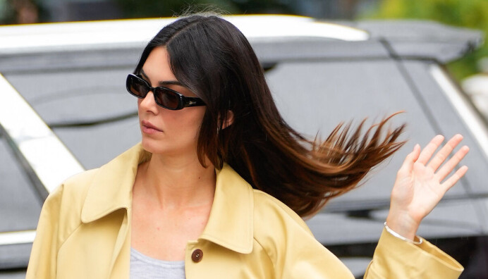 Kendall Jenner is seen on September 18, 2023 in New York City in a butter yellow coat.