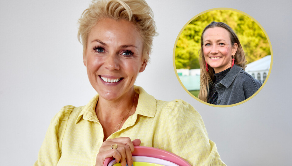 Lene Beier står i en gul skjorte og smiler.