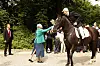 Dronning Margrethe og prins Henrik modtager ringrideroptoget i 2012.