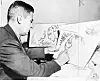 Theodor Seuss Geisel 1904  1991, American writer, poet, and cartoonist at work on a drawing of a grinch, the hero of his forthcoming book, 'How the Grinch Stole Christmas' (Photo by: Universal History Archive/Universal Images Group via Getty Images)
