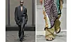 Model på catwalk med stort tørklæde stylet over bukser i lag-på-lag-look.