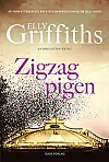 Bogforside med titlen Zigzag-pigen af Elly Griffiths over en kuppelformet bygning.
