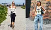 To kvinder i sommeroutfits går på brostensbelagte gader i byen.
